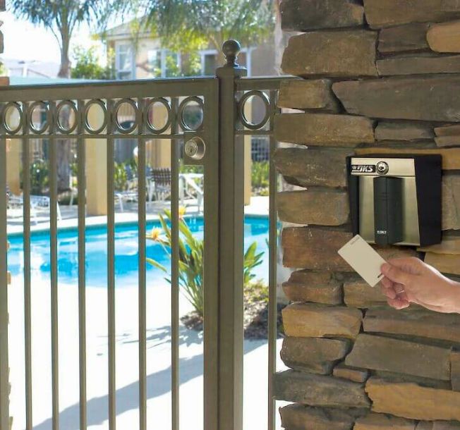 person using key card at entry way