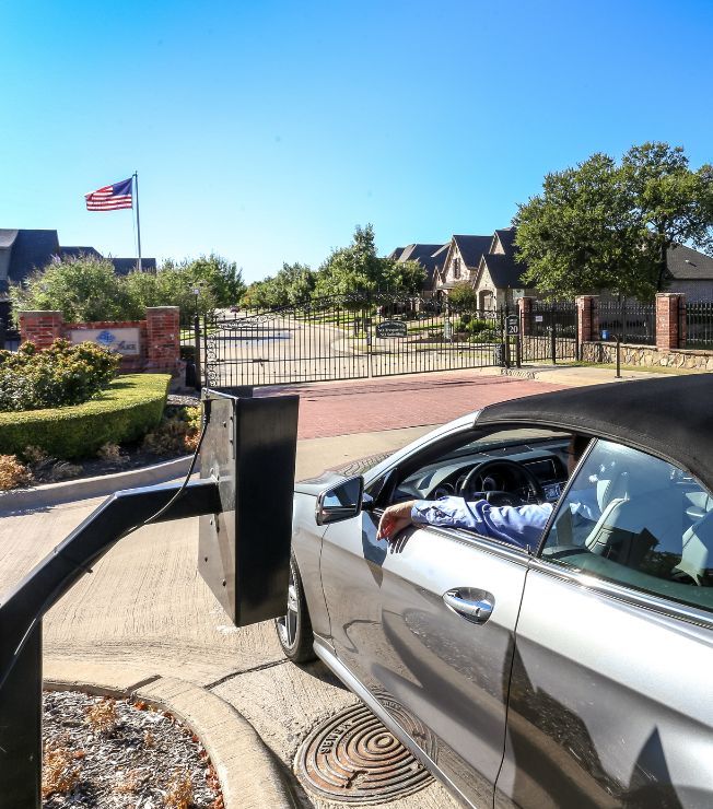 person in car using entry intercom