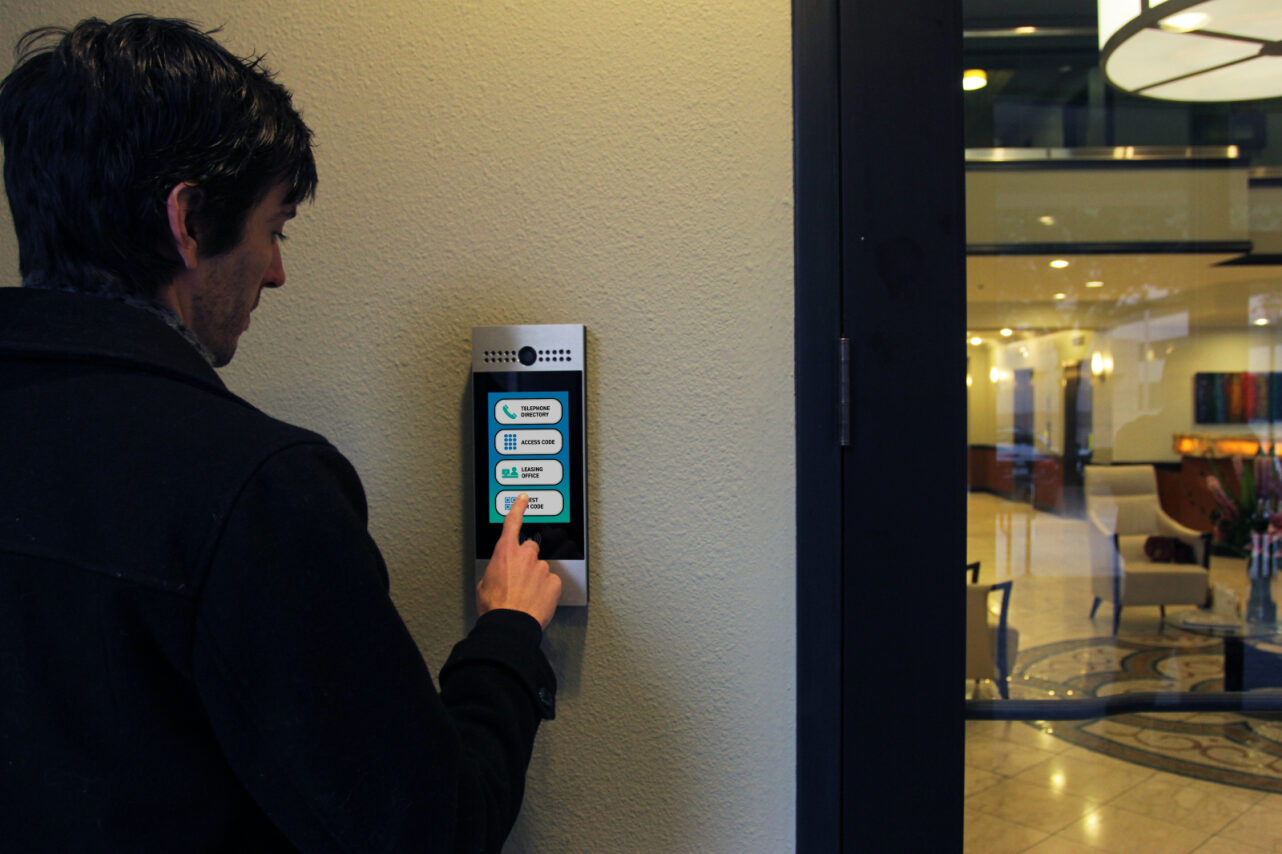 man using touch screen keypad