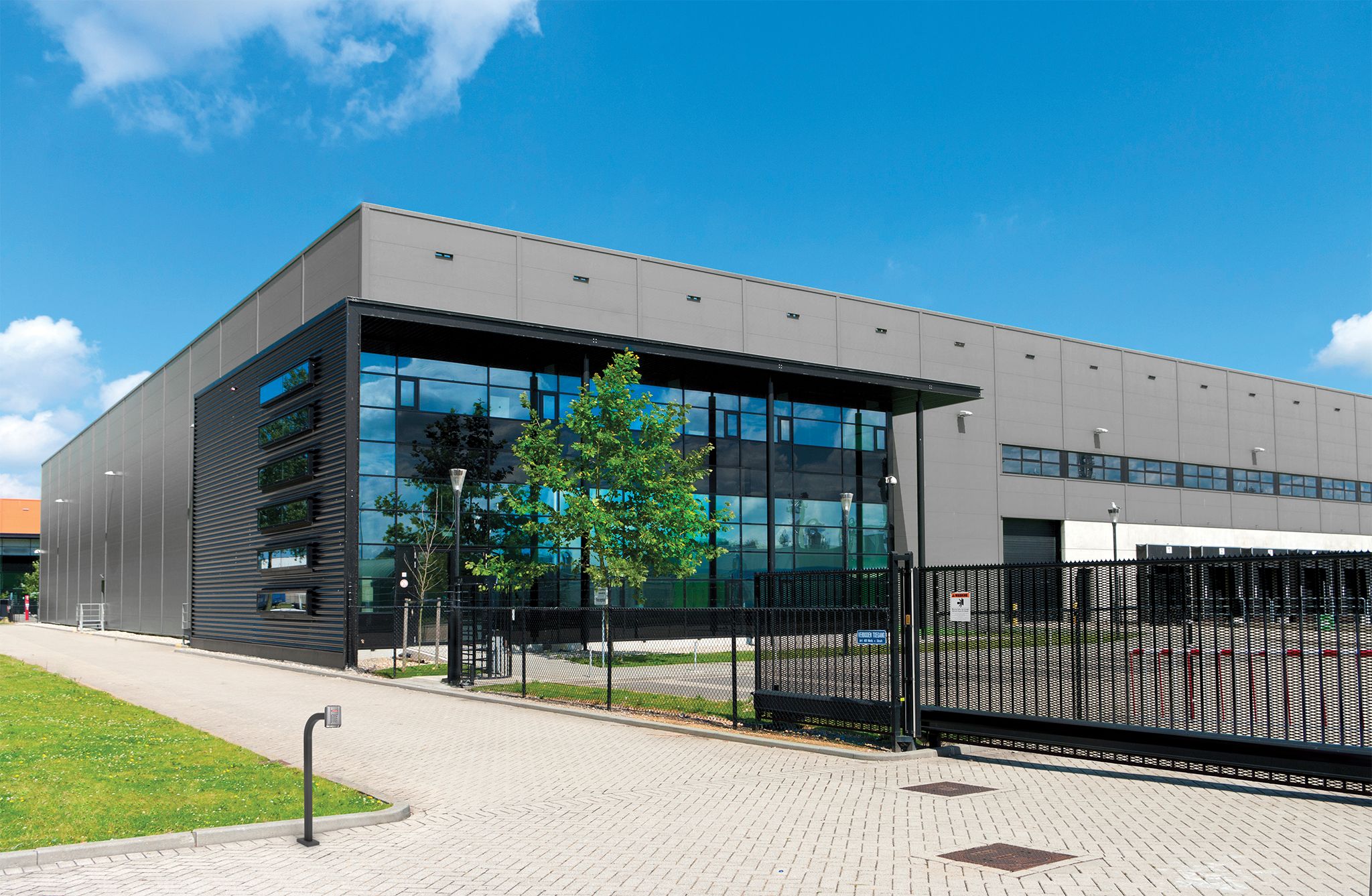 slide gate at industrial office building parking lot
